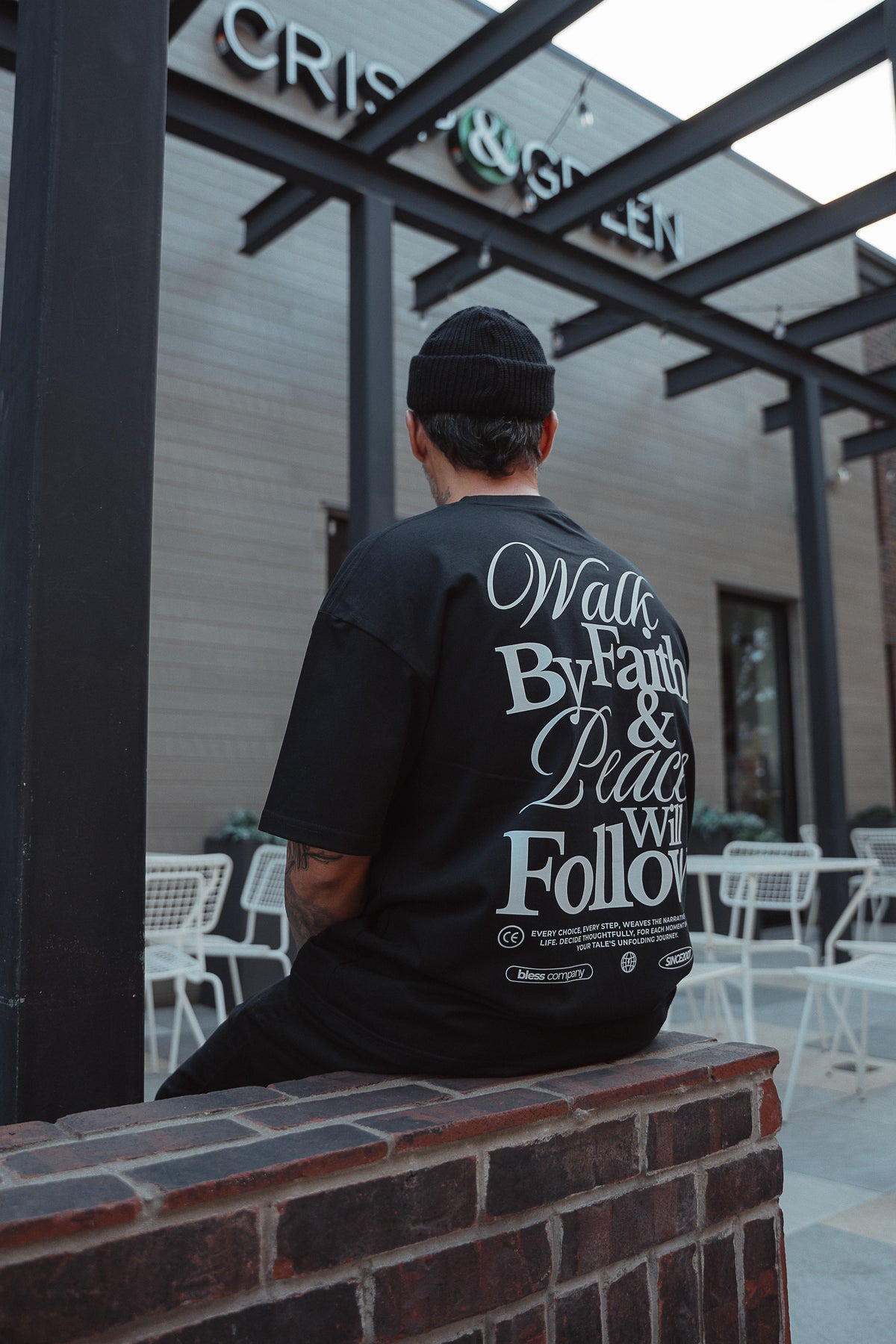 Walk by Faith Black Oversized Tee lifestyle seated